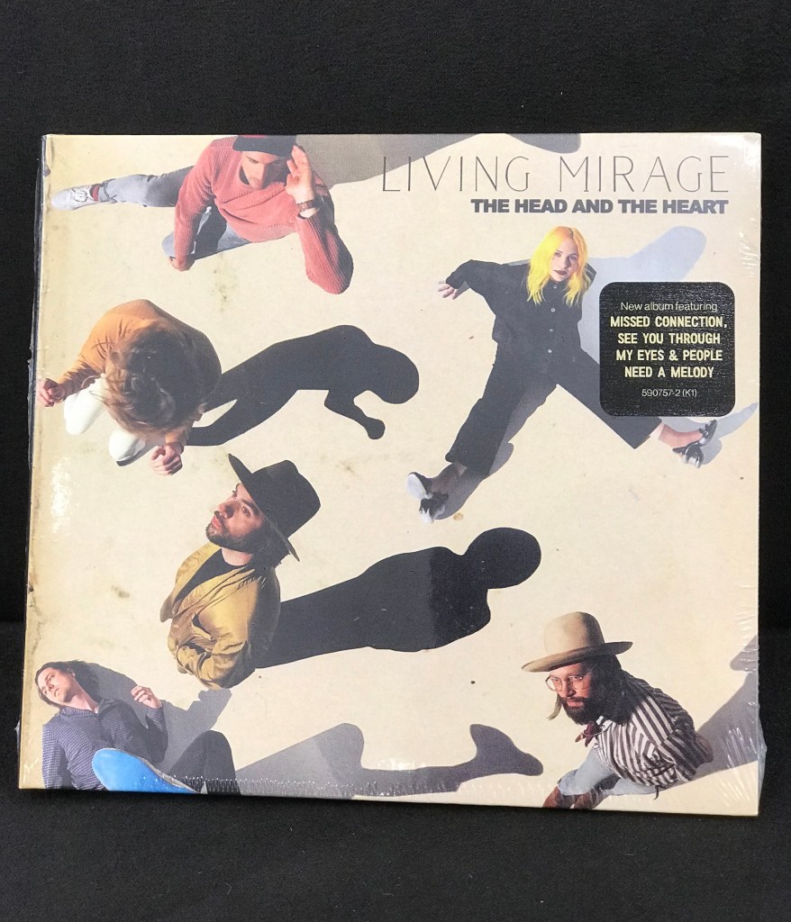 The Head and the Heart - "Living Mirage" CD laid on a black background.