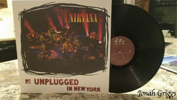 A photo of Nirvana's "Unplugged in New York" displayed on a countertop.